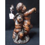 A PAIR OF CARVED WALNUT PUTTI