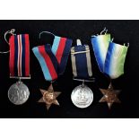 A GROUP OF WWII MEDALS, BOXED