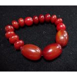 A SIMULATED AMBER BEAD BRACELET