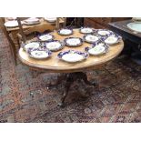 A VICTORIAN FIGURED WALNUT LOO TABLE