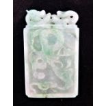 A CARVED JADEITE DRAGON PENDANT