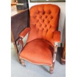 A VICTORIAN MAHOGANY AND BUTTON UPHOLSTERED LIBRARY ARMCHAIR