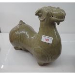 A GREEN GLAZED POTTERY RHYTON IN THE FORM OF A SHEEP
