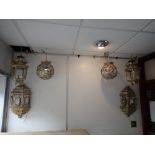 A PAIR OF EASTERN STYLE METAL FRAMED GLAZED WALL LANTERNS