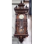 A VICTORIAN WALNUT-CASED VIENNA STYLE 'KEYHOLE' WALL CLOCK