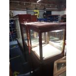 A PAIR OF GLAZED MAHOGANY SHOP DISPLAY CABINETS