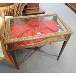 A CARVED WOOD AND GLAZED BIJOUTERIE TABLE