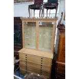 A MODERN LIGHT OAK COLLECTORS CABINET SECRETAIRE