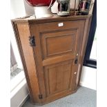 AN OAK HANGING CORNER CUPBOARD IN JACOBEAN STYLE