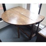 AN OAK GATELEG DINING TABLE IN JACOBEAN STYLE