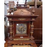 A LARGE 19TH CENTURY GERMAN BRACKET CLOCK in a walnut case with a silvered dial, 60cm high