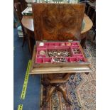 A VICTORIAN WALNUT SEWING TABLE, with a fitted interior