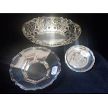 A COLLECTION OF SILVER DISHES, to include one with inset "Hong Kong 5 Dollar" coin (3)