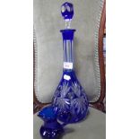 A BLUE OVERLAID CUT GLASS DECANTER, 40cm high