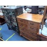 A REPRODUCTION YEW CHEST OF DRAWERS