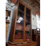 A VICTORIAN STRIPPED PINE GLAZED CABINET