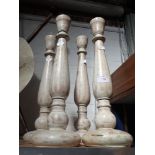 FOUR PAINTED TURNED WOOD CANDLESTICKS with spikes to the top