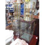 A BRASS FRAMED HEXAGONAL TABLE DISPLAY VITRINE