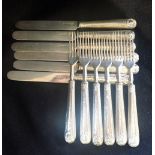 A SET OF SIX VICTORIAN SILVER DESSERT KNIVES AND FORKS, with filled handles
