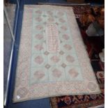 A WOOLWORK RUG, 120cms x 222cms and a Kelim 105cms x 158cms, plus long fringes