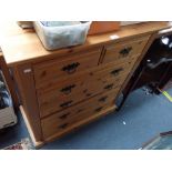 A CONTEMPORARY PINE CHEST OF DRAWERS, 84cm wide and a matching bookcase fitted two drawers below