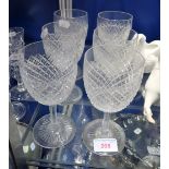 A SET OF SIX CUT GLASS WINE GLASSES