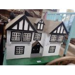 A 1930S DOLL'S HOUSE, 60cms wide