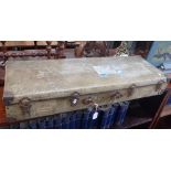 A VINTAGE TRAVELLING CASE with remains of Cunard labels from the 'Britannic'