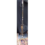 AN EDWARDIAN ART NOUVEAU STYLE BRASS STANDARD LAMP