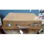 A LEATHER COVERED ATTACHE CASE