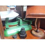 A SET OF AVERY KITCHEN SCALES AND A TURNED WOODEN BOOKSTAND