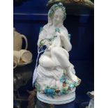 A VICTORIAN CERAMIC STUDY OF A SEATED WOMAN, possibly Moore's pottery, 23cm high