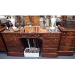 A REPRODUCTION BURR WALNUT PEDESTAL DESK with inset brown leather top