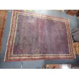 A LARGE BLUE GROUND PERSIAN STYLE RUG with red and blue borders