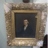 PORTRAIT OF A YOUNG MAN, 19TH CENTURY OIL ON PANEL in distressed gilt frame