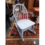 A CHILD'S BLUE PAINTED ROCKING CHAIR