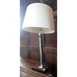 A CONTEMPORARY CHROME AND FAUX ROSEWOOD TABLE LAMP