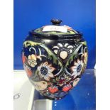 MOORCROFT; A LIDDED POT decorated with strawberries, 14cm high