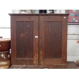 A VICTORIAN PINE TWO DOOR CUPBOARD