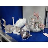 LLADRO; THREE STUDIES OF KITTENS and a swan (4) (all boxed)