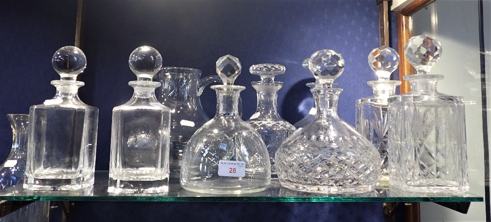 A COLLECTION OF DECANTERS AND A WATER JUG