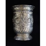 AN EMBOSSED SILVER POT