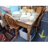 A VICTORIAN STRIPPED PINE FARMHOUSE TABLE, fitted a drawer, 138cm long and five similar chairs