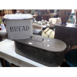 A TINPLATE FISH KETTLE, 63cms long and an enamel breadbin