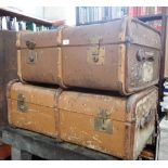 AN EDWARDIAN CANVAS COVERED WOODEN BOUND TRAVELLING TRUNK with interior tray, and another similar