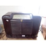 A VINTAGE 'WESTMINSTER' RADIO in a brown bakelite case