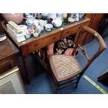 A VICTORIAN MAHOGANY WRITING TABLE fitted two drawers, 105cm wide and a cane seat chair