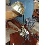 A BRASS STUDENT'S LAMP WITH SHELL SHADE and a kitsch wrought iron lamp