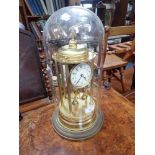 A LARGE ANNIVERSARY CLOCK under a glass dome, 43cm high (overall)