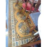 A GOLD GROUND PERSIN STYLE CARPET, length 255cm, width 150cm, AND A PERSIAN STYLE PEACOCK RUNNER, le